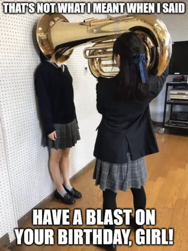 Girl Putting Tuba on Girl's Head Meme.