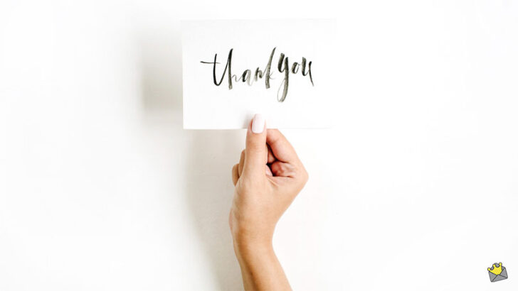 Thank you message on image of woman holding Thank you card.